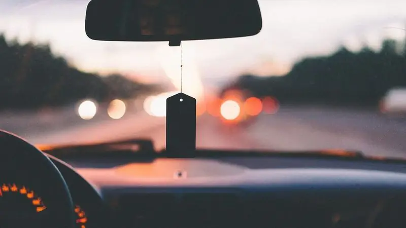 Driver's view of traffic lights from a car dashboard at night — Uber and Lyft accident claims in Los Angeles, CA